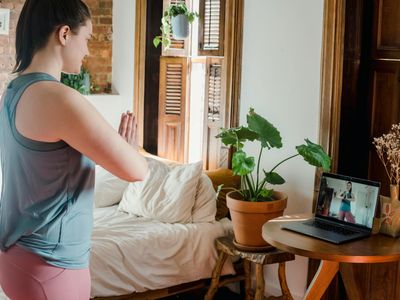 Sunlight hitting a green plant in a zen yoga space.
